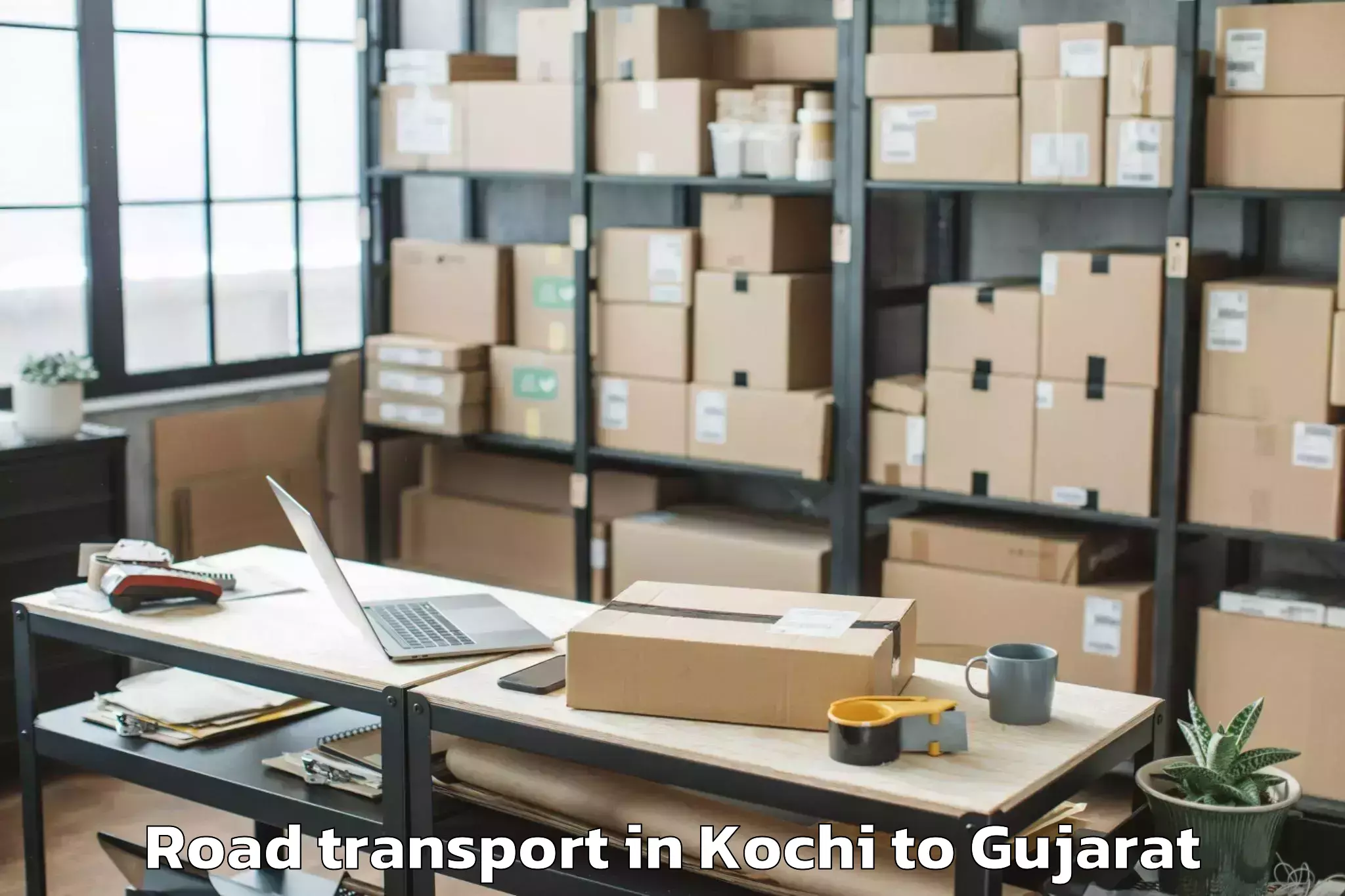 Book Kochi to Junagadh Agricultural Universi Road Transport Online